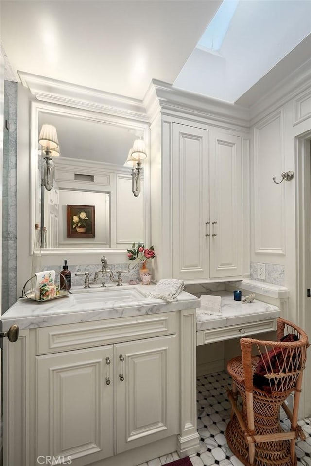 22372 Harwich Ln, Huntington Beach, CA 92646 - bathroom featuring a skylight and vanity