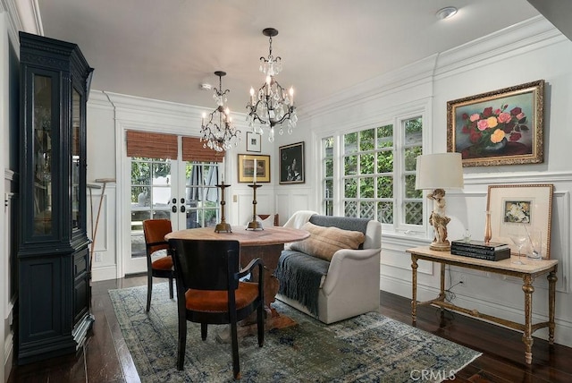 22372 Harwich Ln, Huntington Beach, CA 92646 - dining space with a decorative wall, plenty of natural light, dark wood-type flooring, a chandelier, and ornamental molding