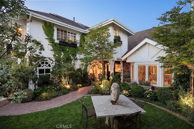 22372 Harwich Ln, Huntington Beach, CA 92646 - back of property with stucco siding and a lawn
