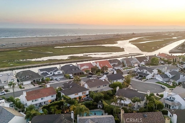 22372 Harwich Ln, Huntington Beach, CA 92646 - aerial view at dusk of view of water and beach and a residential view