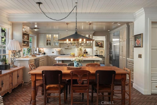 22372 Harwich Ln, Huntington Beach, CA 92646 - dining space with brick floors, wooden ceiling, and crown molding