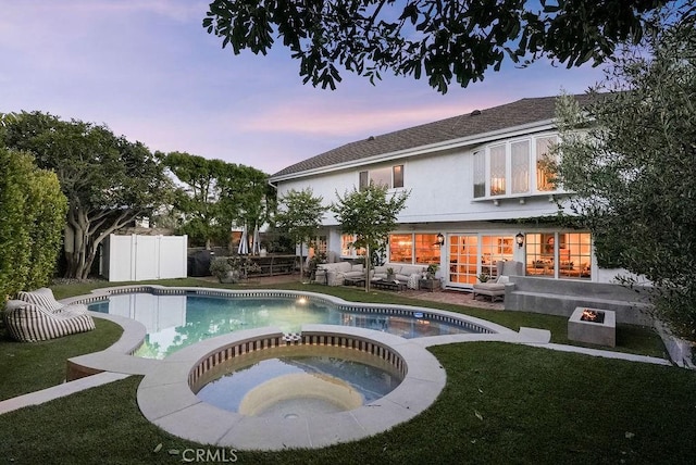 22372 Harwich Ln, Huntington Beach, CA 92646 - pool at dusk featuring outdoor lounge area and a pool with connected hot tub