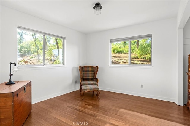 814 Natures Way, Paradise, CA 95969 - living area featuring plenty of natural light, wood finished floors, and baseboards