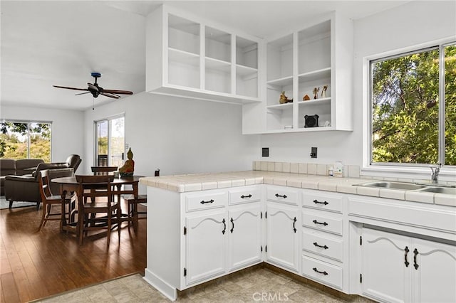 814 Natures Way, Paradise, CA 95969 - kitchen featuring ceiling fan, white cabinets, a sink, and tile countertops
