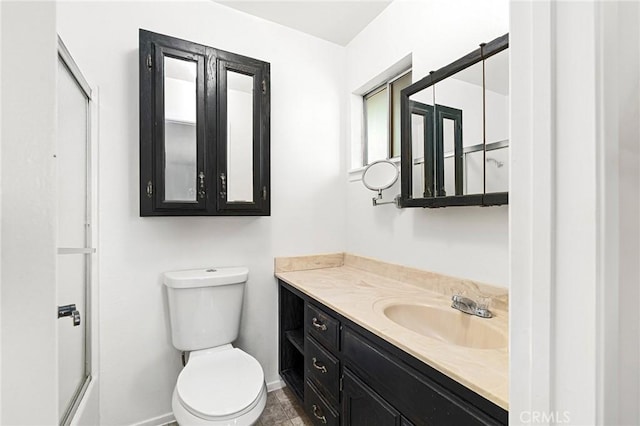 814 Natures Way, Paradise, CA 95969 - bathroom with toilet, vanity, baseboards, and a shower with door