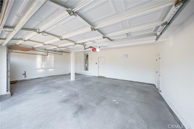 12800 N Overlook Dr, Rancho Cucamonga, CA 91739 - garage featuring a garage door opener and baseboards