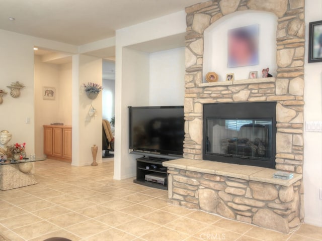15585 Marnie Pl, Fontana, CA 92336 - living room with tile patterned floors, a stone fireplace, and baseboards