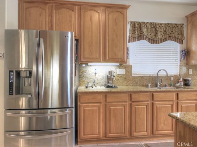 15585 Marnie Pl, Fontana, CA 92336 - kitchen with stainless steel fridge, a sink, light stone countertops, and tasteful backsplash
