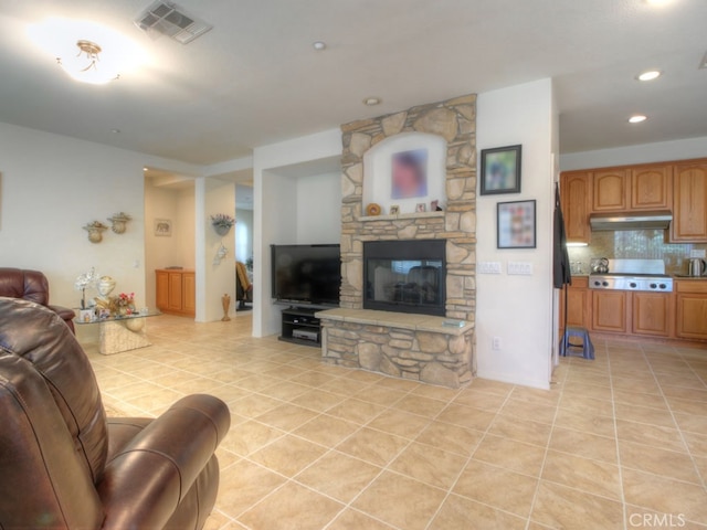 15585 Marnie Pl, Fontana, CA 92336 - living room featuring light tile patterned flooring, a fireplace, and recessed lighting