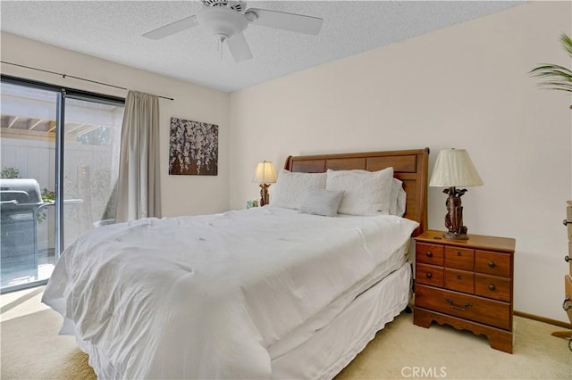 69723 Encanto Ct, Rancho Mirage, CA 92270 - bedroom with access to outside, light colored carpet, a textured ceiling, ceiling fan, and baseboards