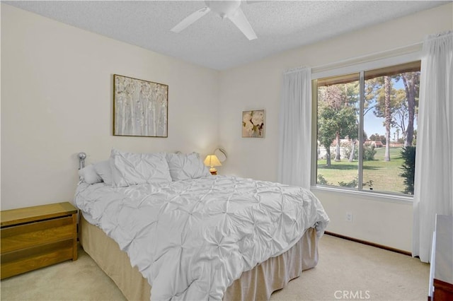 69723 Encanto Ct, Rancho Mirage, CA 92270 - bedroom featuring a textured ceiling, carpet, and ceiling fan