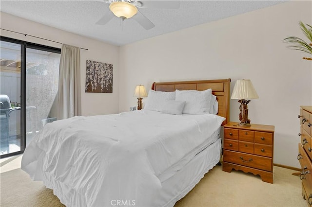 69723 Encanto Ct, Rancho Mirage, CA 92270 - bedroom with access to exterior, light colored carpet, ceiling fan, and a textured ceiling