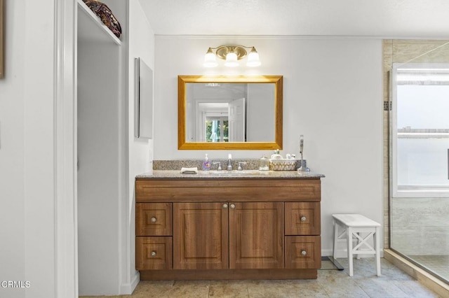 1025 Cachuma Ave Unit 32, Ventura, CA 93004 - full bath featuring vanity, walk in shower, baseboards, and tile patterned flooring