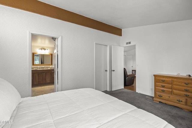 1025 Cachuma Ave Unit 32, Ventura, CA 93004 - bedroom featuring carpet, connected bathroom, and vaulted ceiling