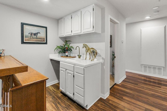 2735 Los Pinos Cir, Camarillo, CA 93012 - kitchen with white cabinetry, dark wood-type flooring, baseboards, light countertops, and recessed lighting