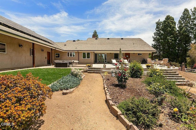 2735 Los Pinos Cir, Camarillo, CA 93012 - rear view of house featuring a hot tub, a patio, and stucco siding