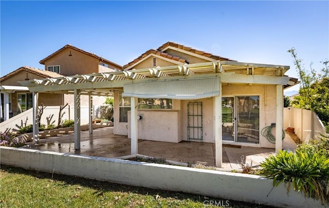 689 Twin Hills Dr, Banning, CA 92220 - back of house featuring a patio, a pergola, stucco siding, and a tiled roof