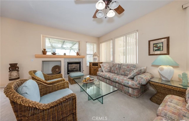689 Twin Hills Dr, Banning, CA 92220 - living area featuring carpet floors, healthy amount of natural light, a ceiling fan, and a tile fireplace