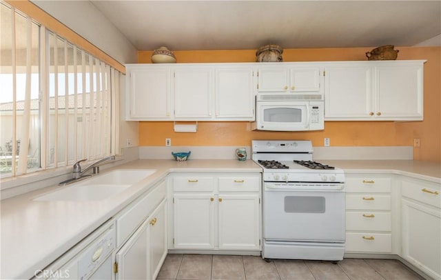 689 Twin Hills Dr, Banning, CA 92220 - kitchen with white appliances, a sink, light tile patterned floors, white cabinetry, and light countertops