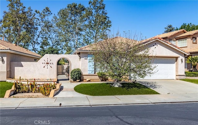 689 Twin Hills Dr, Banning, CA 92220 - mediterranean / spanish-style house with an attached garage, stucco siding, concrete driveway, and a tiled roof