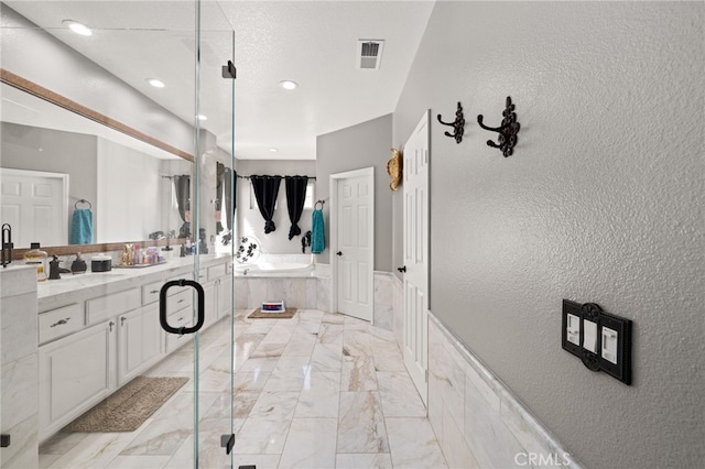 18936 Summerleaf Ln, Riverside, CA 92504 - full bathroom featuring marble finish floors, a garden tub, vanity, recessed lighting, and a stall shower