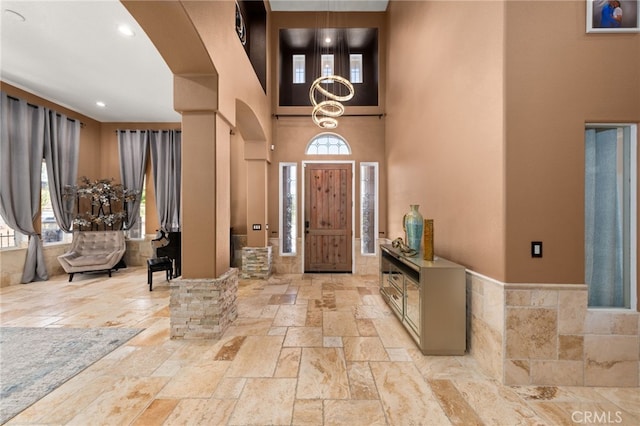 18936 Summerleaf Ln, Riverside, CA 92504 - entryway featuring stone tile flooring, a high ceiling, healthy amount of natural light, and recessed lighting