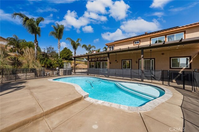 18936 Summerleaf Ln, Riverside, CA 92504 - view of swimming pool with a patio area