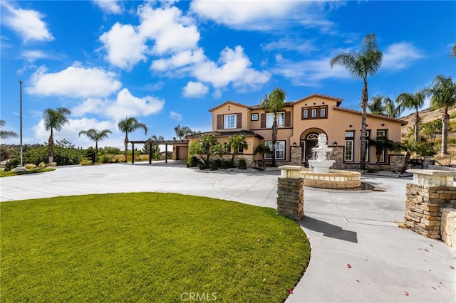 18936 Summerleaf Ln, Riverside, CA 92504 - view of front of house with a front lawn, stucco siding, and stone siding