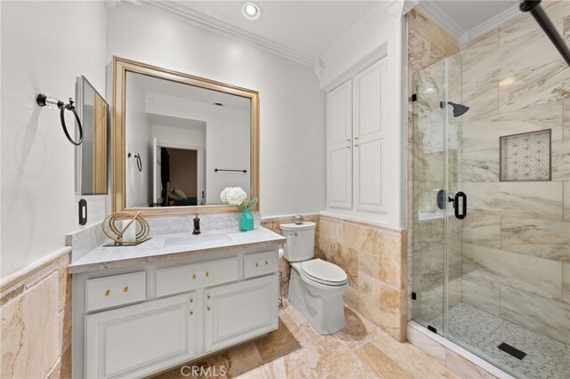 18936 Summerleaf Ln, Riverside, CA 92504 - bathroom featuring crown molding, wainscoting, vanity, a marble finish shower, and toilet