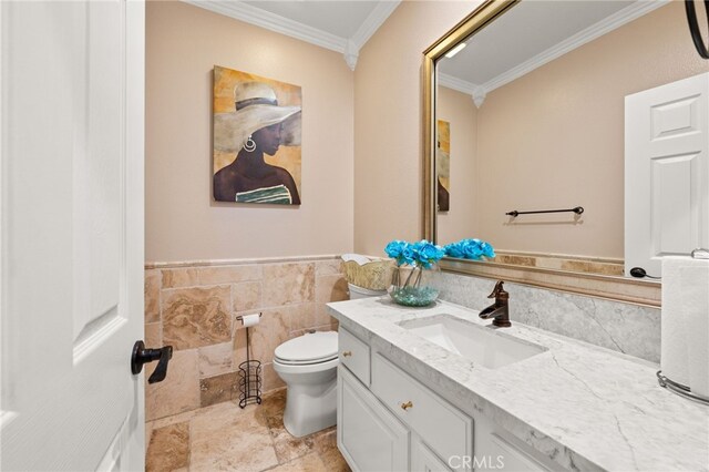 18936 Summerleaf Ln, Riverside, CA 92504 - half bath with ornamental molding, vanity, toilet, tile walls, and wainscoting