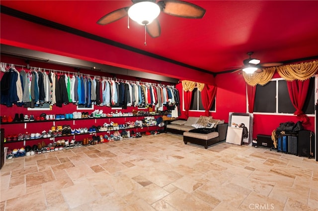18936 Summerleaf Ln, Riverside, CA 92504 - home theater featuring a ceiling fan, stone finish floors, and ornamental molding