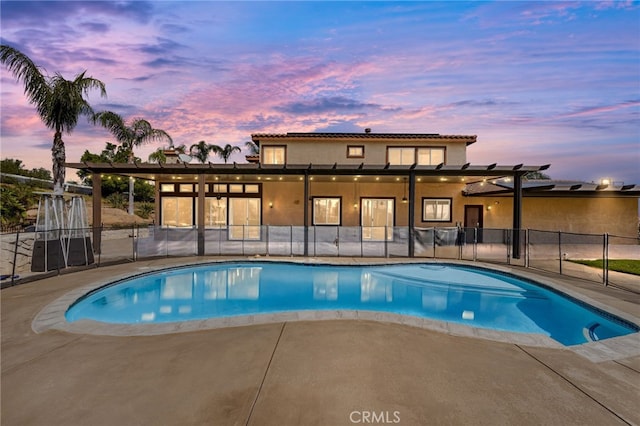 18936 Summerleaf Ln, Riverside, CA 92504 - pool at dusk with a patio