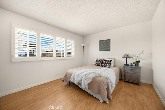 419 Clairmont Ave, Placentia, CA 92870 - bedroom with wood finished floors, a textured ceiling, and baseboards