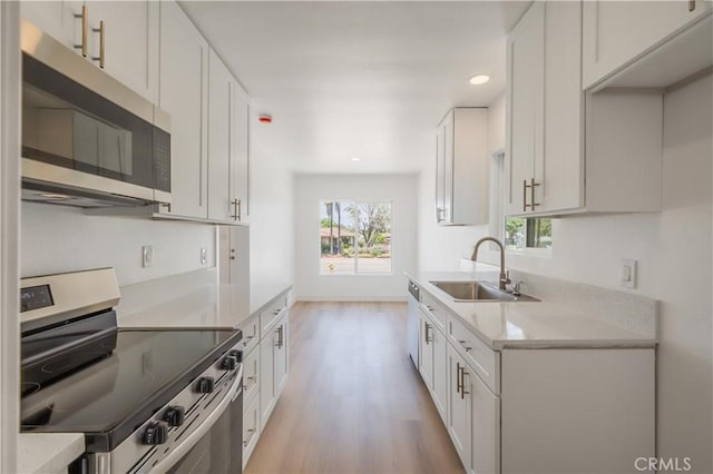 15058 Gale Ave, Hacienda Heights, CA 91745 - kitchen with appliances with stainless steel finishes, a sink, plenty of natural light, light wood-style floors, and recessed lighting