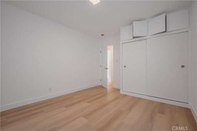 15058 Gale Ave, Hacienda Heights, CA 91745 - unfurnished bedroom featuring light wood-type flooring and a closet