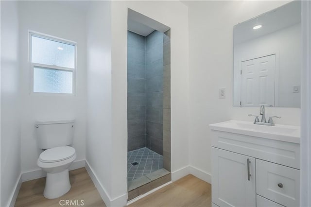 15058 Gale Ave, Hacienda Heights, CA 91745 - bathroom featuring wood finished floors, vanity, toilet, and a tile shower