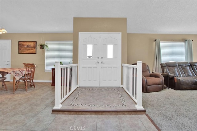 18603 Mecca St, Hesperia, CA 92345 - foyer entrance with tile patterned floors, a textured ceiling, and baseboards