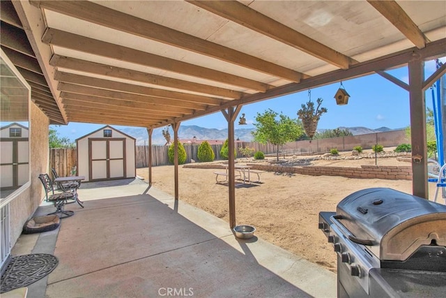 18603 Mecca St, Hesperia, CA 92345 - fenced backyard featuring a mountain view, area for grilling, and a patio