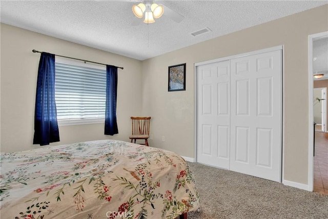 18603 Mecca St, Hesperia, CA 92345 - carpeted bedroom with a closet, a textured ceiling, a ceiling fan, and baseboards