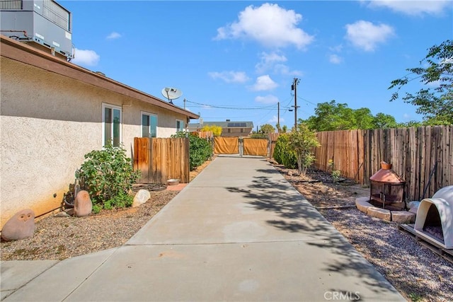 18603 Mecca St, Hesperia, CA 92345 - view of concrete driveway featuring a gate and a gated entry