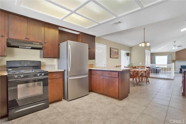 18603 Mecca St, Hesperia, CA 92345 - kitchen featuring black gas range, under cabinet range hood, freestanding refrigerator, a peninsula, and ceiling fan