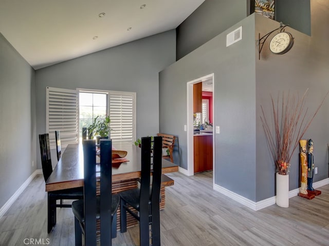 1400 Ashley Pl, Upland, CA 91784 - dining space with healthy amount of natural light, light wood-style floors, baseboards, and high vaulted ceiling