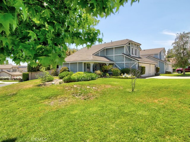 1400 Ashley Pl, Upland, CA 91784 - view of front of property with concrete driveway, a front yard, and stucco siding