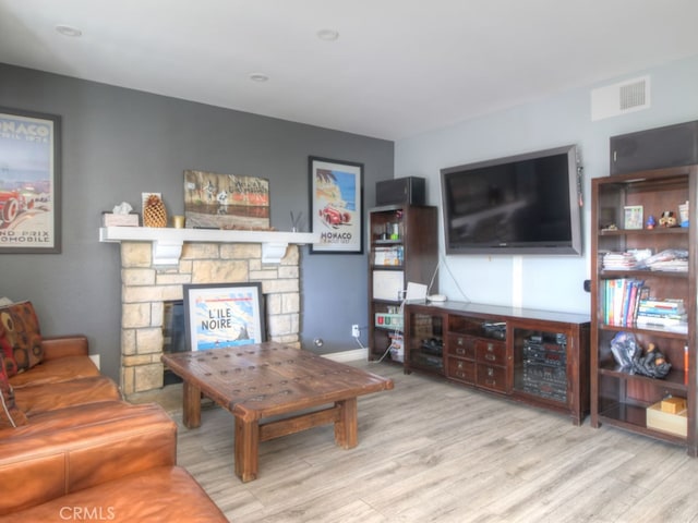 1400 Ashley Pl, Upland, CA 91784 - living room featuring wood finished floors, a fireplace, and baseboards