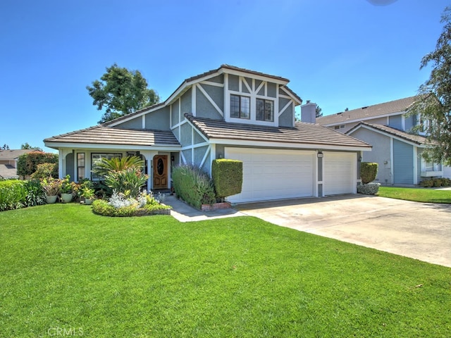 1400 Ashley Pl, Upland, CA 91784 - english style home featuring stucco siding, driveway, a front lawn, and a tiled roof