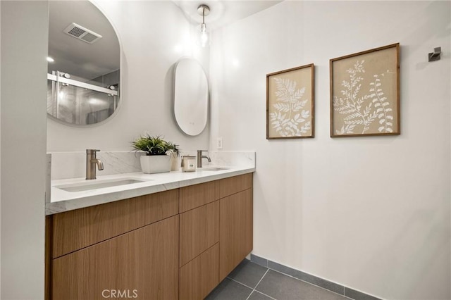 2009 Pattiz Ave, Long Beach, CA 90815 - full bath with tile patterned flooring, double vanity, baseboards, and a shower with shower door