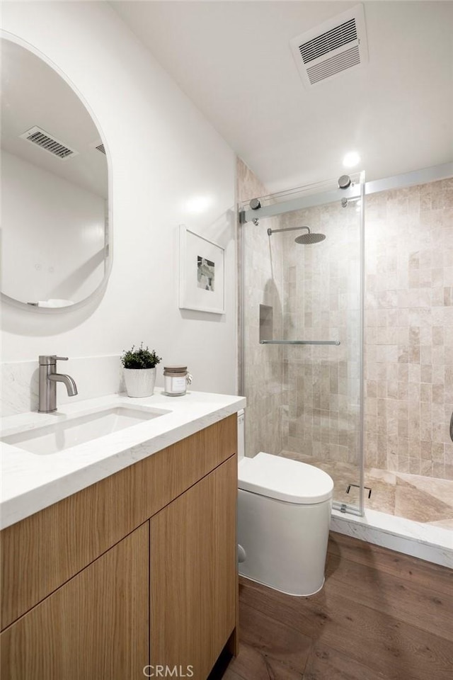 2009 Pattiz Ave, Long Beach, CA 90815 - full bathroom featuring vanity, a stall shower, toilet, and wood finished floors