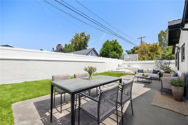 2009 Pattiz Ave, Long Beach, CA 90815 - fenced backyard featuring an outdoor hangout area, a patio, and outdoor dining space