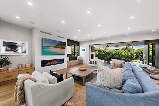 213 Avenida Princesa, San Clemente, CA 92672 - living room featuring a glass covered fireplace, healthy amount of natural light, light wood finished floors, and recessed lighting
