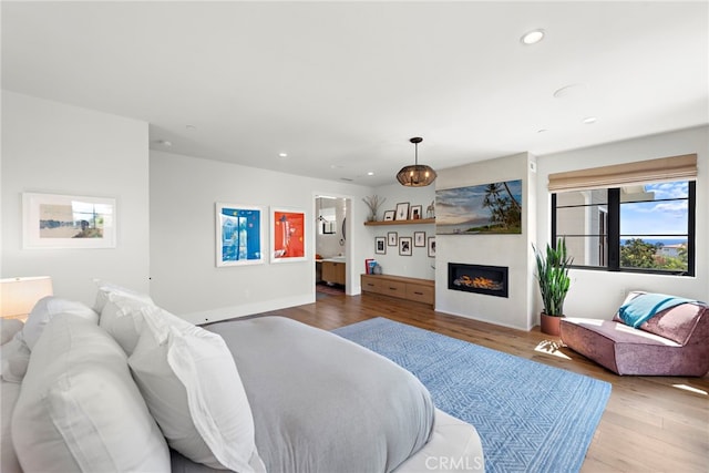 213 Avenida Princesa, San Clemente, CA 92672 - living room featuring wood finished floors, recessed lighting, a glass covered fireplace, and baseboards